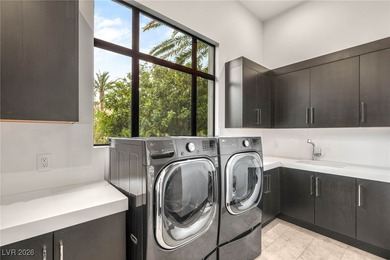 Tucked behind the gates of MacDonald Highlands, this exquisite on Dragon Ridge Country Club in Nevada - for sale on GolfHomes.com, golf home, golf lot