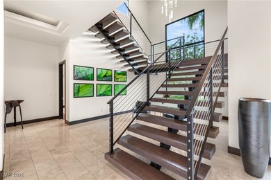 Tucked behind the gates of MacDonald Highlands, this exquisite on Dragon Ridge Country Club in Nevada - for sale on GolfHomes.com, golf home, golf lot