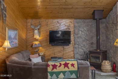 Rustic Cabin Retreat with Lake & Mountain Views in Columbine on Grand Lake Golf Course in Colorado - for sale on GolfHomes.com, golf home, golf lot