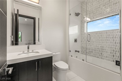 Tucked behind the gates of MacDonald Highlands, this exquisite on Dragon Ridge Country Club in Nevada - for sale on GolfHomes.com, golf home, golf lot