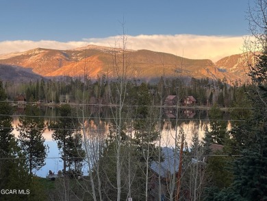 Rustic Cabin Retreat with Lake & Mountain Views in Columbine on Grand Lake Golf Course in Colorado - for sale on GolfHomes.com, golf home, golf lot