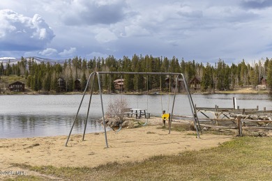 Rustic Cabin Retreat with Lake & Mountain Views in Columbine on Grand Lake Golf Course in Colorado - for sale on GolfHomes.com, golf home, golf lot