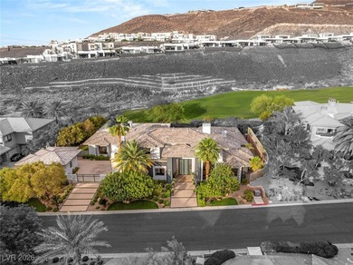 Tucked behind the gates of MacDonald Highlands, this exquisite on Dragon Ridge Country Club in Nevada - for sale on GolfHomes.com, golf home, golf lot
