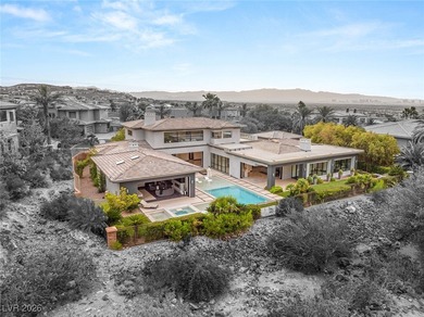 Tucked behind the gates of MacDonald Highlands, this exquisite on Dragon Ridge Country Club in Nevada - for sale on GolfHomes.com, golf home, golf lot