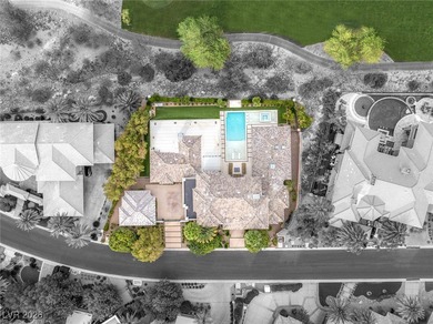 Tucked behind the gates of MacDonald Highlands, this exquisite on Dragon Ridge Country Club in Nevada - for sale on GolfHomes.com, golf home, golf lot