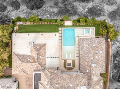 Tucked behind the gates of MacDonald Highlands, this exquisite on Dragon Ridge Country Club in Nevada - for sale on GolfHomes.com, golf home, golf lot