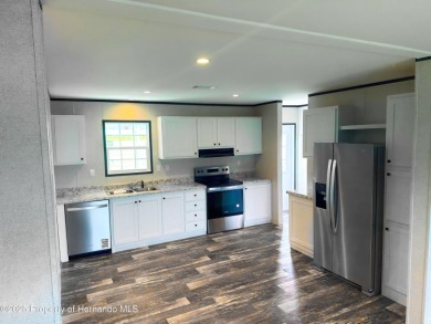 Welcome to this breathtaking, open-concept Modern home built on Brookridge Country Club in Florida - for sale on GolfHomes.com, golf home, golf lot