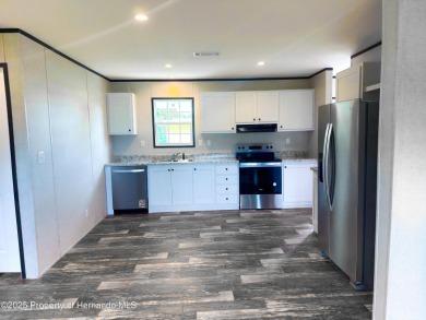 Welcome to this breathtaking, open-concept Modern home built on Brookridge Country Club in Florida - for sale on GolfHomes.com, golf home, golf lot