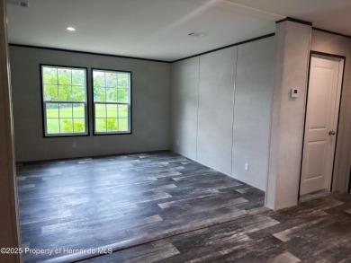 Welcome to this breathtaking, open-concept Modern home built on Brookridge Country Club in Florida - for sale on GolfHomes.com, golf home, golf lot