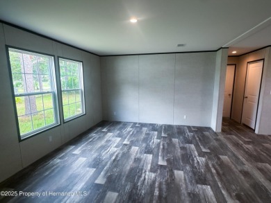 Welcome to this breathtaking, open-concept Modern home built on Brookridge Country Club in Florida - for sale on GolfHomes.com, golf home, golf lot