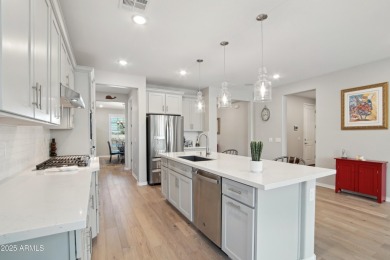 Enjoy panoramic mountain views and Phoenix skyline sunrises from on Verrado Golf Club  in Arizona - for sale on GolfHomes.com, golf home, golf lot