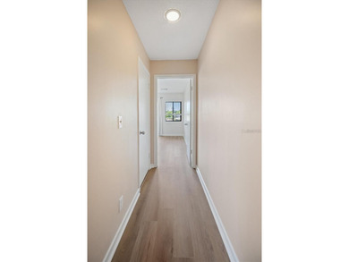 Don't miss this rare opportunity to own a light-filled on Palm Harbor Golf Club in Florida - for sale on GolfHomes.com, golf home, golf lot