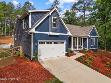 Impeccably maintained, this exquisite home resides on a tranquil on Foxfire Golf and Country Club in North Carolina - for sale on GolfHomes.com, golf home, golf lot