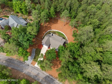 Impeccably maintained, this exquisite home resides on a tranquil on Foxfire Golf and Country Club in North Carolina - for sale on GolfHomes.com, golf home, golf lot