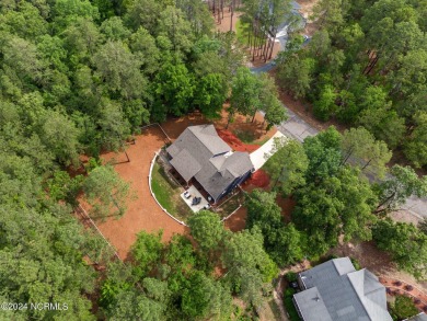 Impeccably maintained, this exquisite home resides on a tranquil on Foxfire Golf and Country Club in North Carolina - for sale on GolfHomes.com, golf home, golf lot