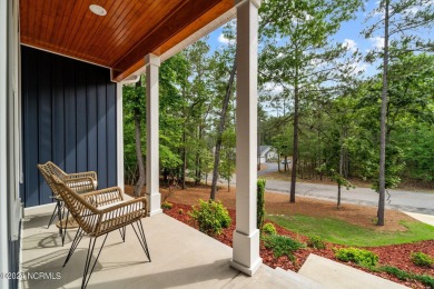 Impeccably maintained, this exquisite home resides on a tranquil on Foxfire Golf and Country Club in North Carolina - for sale on GolfHomes.com, golf home, golf lot