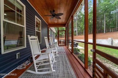 Impeccably maintained, this exquisite home resides on a tranquil on Foxfire Golf and Country Club in North Carolina - for sale on GolfHomes.com, golf home, golf lot