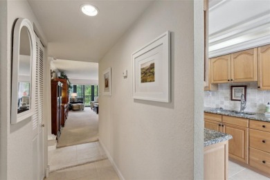 Discover refined living in this beautifully updated 2-bedroom on Cove Cay Country Club in Florida - for sale on GolfHomes.com, golf home, golf lot