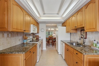 Discover refined living in this beautifully updated 2-bedroom on Cove Cay Country Club in Florida - for sale on GolfHomes.com, golf home, golf lot