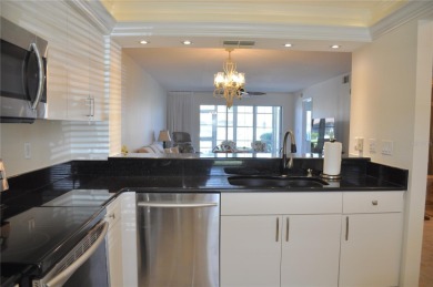 If you are looking for a turnkey, fully furnished, ground floor on Saint Andrews South Golf Club in Florida - for sale on GolfHomes.com, golf home, golf lot