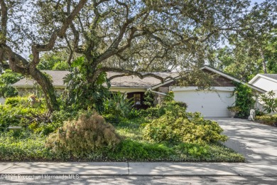 Welcome to this beautifully landscaped corner lot home located on Beacon Woods Golf Club in Florida - for sale on GolfHomes.com, golf home, golf lot