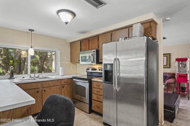 Welcome to this beautifully landscaped corner lot home located on Beacon Woods Golf Club in Florida - for sale on GolfHomes.com, golf home, golf lot