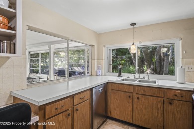 Welcome to this beautifully landscaped corner lot home located on Beacon Woods Golf Club in Florida - for sale on GolfHomes.com, golf home, golf lot