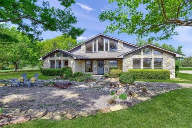 Discover serenity in this custom Stone home situated on over 1.2 on Denison Country Club in Texas - for sale on GolfHomes.com, golf home, golf lot