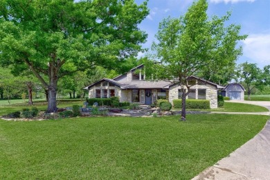 Discover serenity in this custom Stone home situated on over 1.2 on Denison Country Club in Texas - for sale on GolfHomes.com, golf home, golf lot