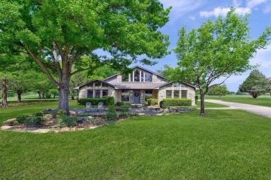 Discover serenity in this custom Stone home situated on over 1.2 on Denison Country Club in Texas - for sale on GolfHomes.com, golf home, golf lot