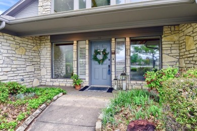 Discover serenity in this custom Stone home situated on over 1.2 on Denison Country Club in Texas - for sale on GolfHomes.com, golf home, golf lot