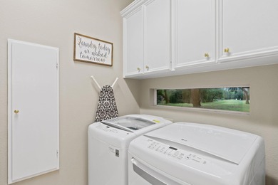 Nestled beneath a canopy of mature trees and overlooking the on Slick Rock Golf Course - Horseshoe Bay in Texas - for sale on GolfHomes.com, golf home, golf lot