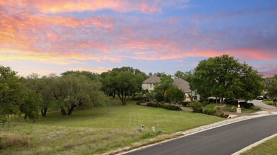 Nestled beneath a canopy of mature trees and overlooking the on Slick Rock Golf Course - Horseshoe Bay in Texas - for sale on GolfHomes.com, golf home, golf lot
