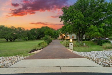 Nestled beneath a canopy of mature trees and overlooking the on Slick Rock Golf Course - Horseshoe Bay in Texas - for sale on GolfHomes.com, golf home, golf lot