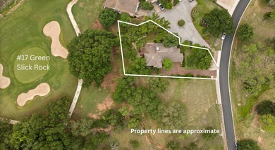 Nestled beneath a canopy of mature trees and overlooking the on Slick Rock Golf Course - Horseshoe Bay in Texas - for sale on GolfHomes.com, golf home, golf lot