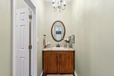 Nestled beneath a canopy of mature trees and overlooking the on Slick Rock Golf Course - Horseshoe Bay in Texas - for sale on GolfHomes.com, golf home, golf lot