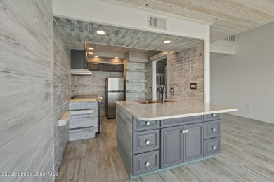 Wake up to the sound of waves in this 3-story, 3 bed, 3 bath on Spessard Holland Golf Course in Florida - for sale on GolfHomes.com, golf home, golf lot