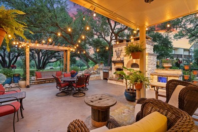 Nestled beneath a canopy of mature trees and overlooking the on Slick Rock Golf Course - Horseshoe Bay in Texas - for sale on GolfHomes.com, golf home, golf lot