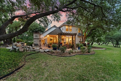 Nestled beneath a canopy of mature trees and overlooking the on Slick Rock Golf Course - Horseshoe Bay in Texas - for sale on GolfHomes.com, golf home, golf lot
