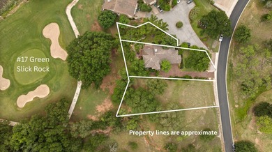 Nestled beneath a canopy of mature trees and overlooking the on Slick Rock Golf Course - Horseshoe Bay in Texas - for sale on GolfHomes.com, golf home, golf lot