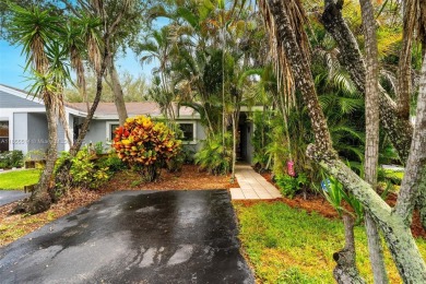 Welcome to Redbridge! This beautifully maintained single-story on Springtree Country Club in Florida - for sale on GolfHomes.com, golf home, golf lot