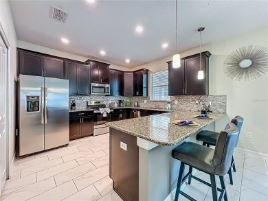 WALKING DISTANCE TO THE CLUBHOUSE. This beautifully designed on The Oasis Club at Champions Gate in Florida - for sale on GolfHomes.com, golf home, golf lot