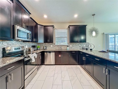 WALKING DISTANCE TO THE CLUBHOUSE. This beautifully designed on The Oasis Club at Champions Gate in Florida - for sale on GolfHomes.com, golf home, golf lot