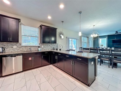 WALKING DISTANCE TO THE CLUBHOUSE. This beautifully designed on The Oasis Club at Champions Gate in Florida - for sale on GolfHomes.com, golf home, golf lot