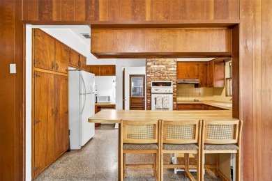 Come see this well-maintained 3-bedroom, 2.5-bath midcentury on Temple Terrace Golf and Country Club in Florida - for sale on GolfHomes.com, golf home, golf lot