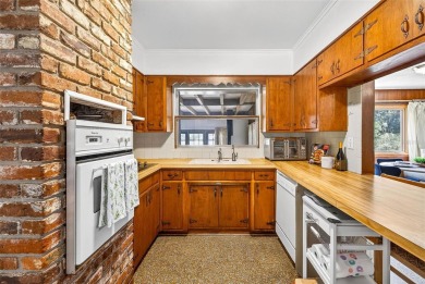 Come see this well-maintained 3-bedroom, 2.5-bath midcentury on Temple Terrace Golf and Country Club in Florida - for sale on GolfHomes.com, golf home, golf lot