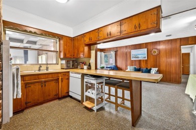 Come see this well-maintained 3-bedroom, 2.5-bath midcentury on Temple Terrace Golf and Country Club in Florida - for sale on GolfHomes.com, golf home, golf lot