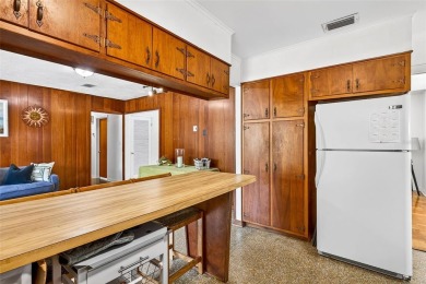 Come see this well-maintained 3-bedroom, 2.5-bath midcentury on Temple Terrace Golf and Country Club in Florida - for sale on GolfHomes.com, golf home, golf lot