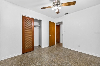Come see this well-maintained 3-bedroom, 2.5-bath midcentury on Temple Terrace Golf and Country Club in Florida - for sale on GolfHomes.com, golf home, golf lot
