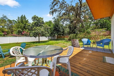 Come see this well-maintained 3-bedroom, 2.5-bath midcentury on Temple Terrace Golf and Country Club in Florida - for sale on GolfHomes.com, golf home, golf lot